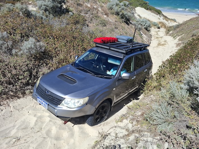 David takes his Forester up the exit track.